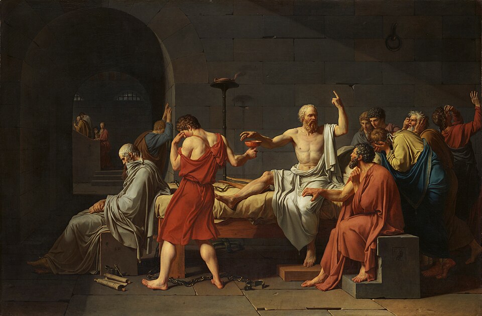 Jacques-Louis David's painting The Death of Socrates, 1787, showing Socrates seated upright on a bed, reaching for a cup of hemlock while gesturing upward with his other hand, surrounded by grieving disciples